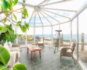 The large conservatory adds plenty of space and a wonderful sea view