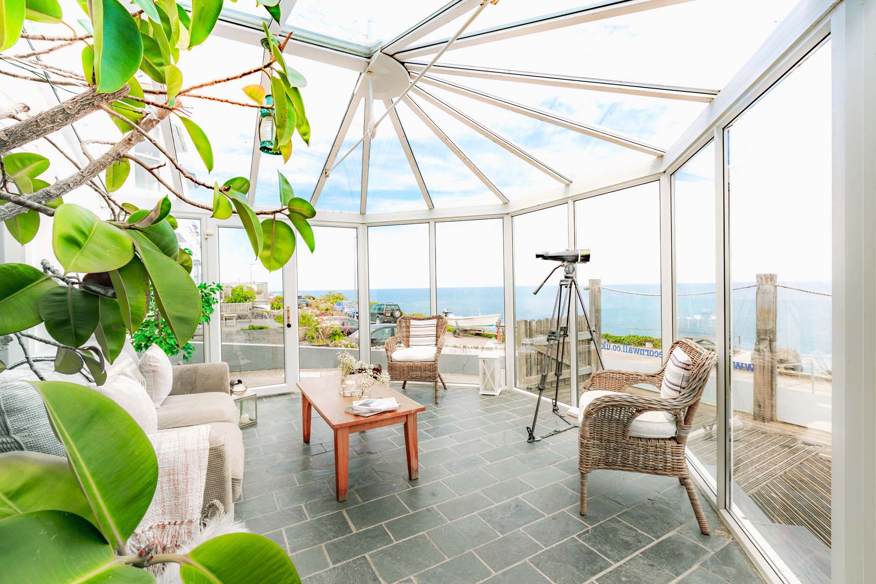 The large conservatory adds plenty of space and a wonderful sea view